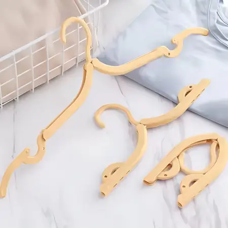 UNaZgKY2AzMcuVObBcGmWf5iTI3zMuaZi5HMUtij.webp Multipurpose Foldable Cloth Hanger with Dual Clips | Space-Saving Travel & Laundry Drying Hanger ( default, OS )
